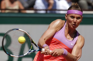 Lucie Safarova of the Czech Republic returns the ball to Serbia's Ana Ivanovic during their semifinal match of the French Open tennis tournament at the Roland Garros stadium, Thursday, June 4, 2015 in Paris, France. (AP Photo/Michel Euler)