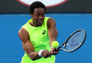 MELBOURNE, AUSTRALIA - JANUARY 15:  Gael Monfils of France plays a backhand in his first round match against Alexandr Dolgopolov of the Ukraine during day two of the 2013 Australian Open at Melbourne Park on January 15, 2013 in Melbourne, Australia.  (Photo by Chris Hyde/Getty Images)
